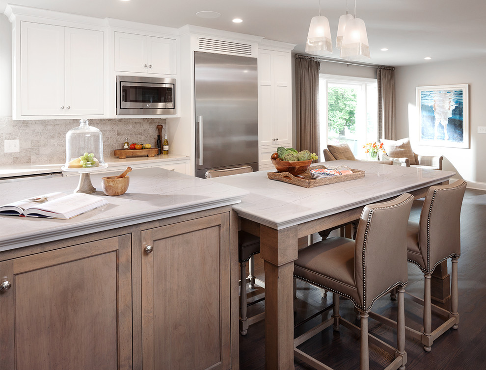 Inspiration for a transitional open plan kitchen in Dallas with shaker cabinets, white cabinets, stainless steel appliances, dark hardwood floors and multiple islands.