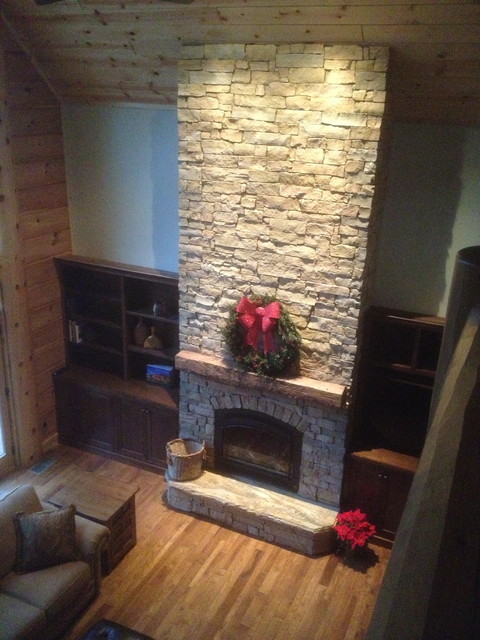 Cathedral ceiling , stone fireplace, custom barn beam ...