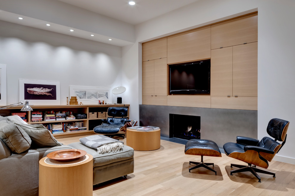 Design ideas for a contemporary open concept living room in Dallas with white walls, light hardwood floors, a standard fireplace, a metal fireplace surround and a built-in media wall.