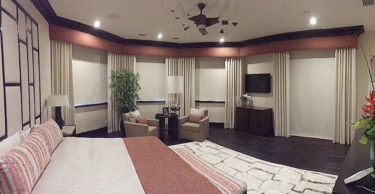 Example of a transitional bedroom design in Miami