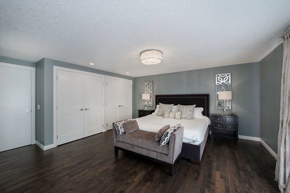 Design ideas for a large transitional master bedroom in Calgary with grey walls, dark hardwood floors and no fireplace.