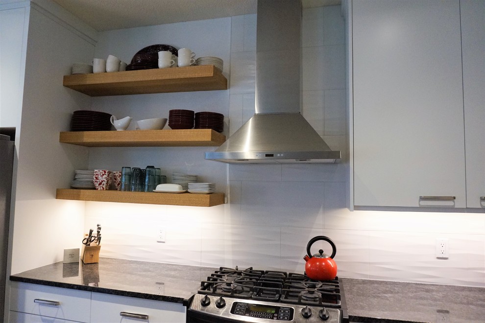 Example of a transitional kitchen design in Calgary