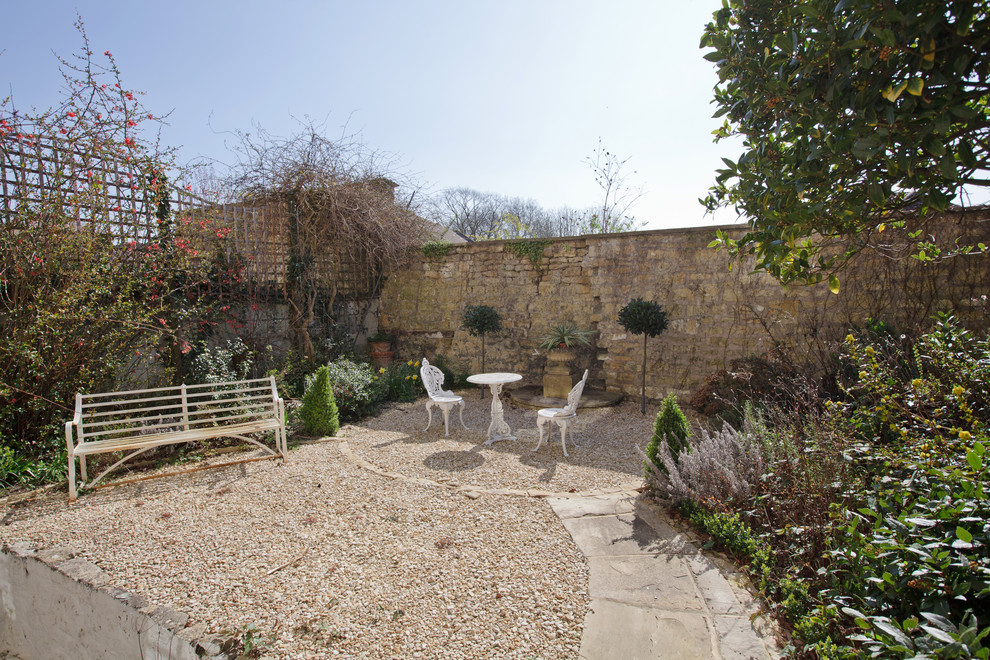 Classic patio in London with gravel and no cover.