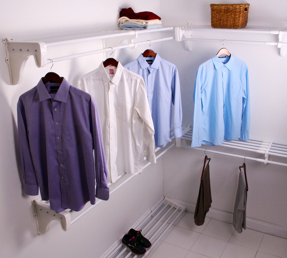 This is an example of a large transitional gender-neutral dressing room in Miami with open cabinets.