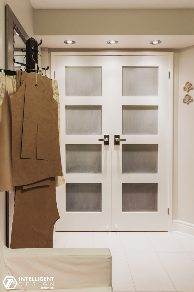 Built-in closet - small transitional gender-neutral laminate floor built-in closet idea in Toronto with shaker cabinets