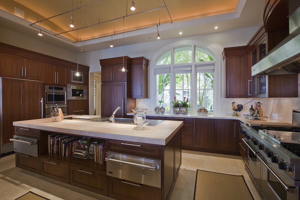 This is an example of a contemporary kitchen in Miami with panelled appliances.