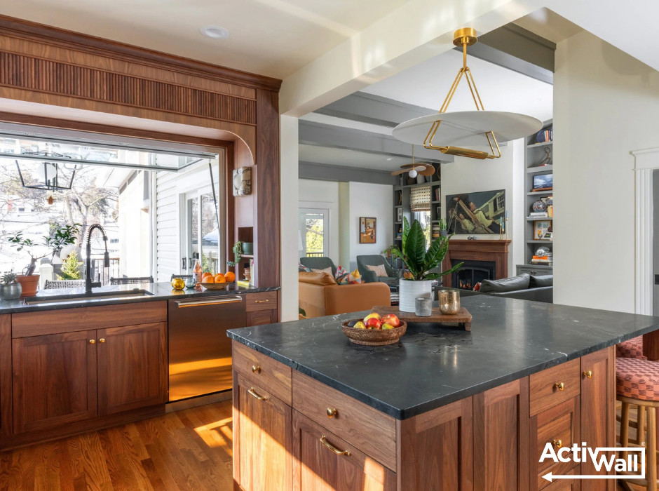 Mid-sized eclectic u-shaped medium tone wood floor and brown floor open concept kitchen photo with recessed-panel cabinets, brown cabinets, green backsplash, ceramic backsplash, stainless steel appliances, an island and black countertops