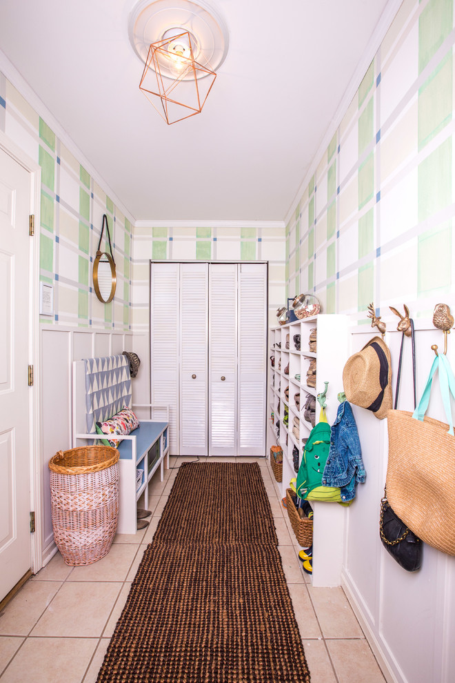 Design ideas for a small beach style mudroom in Louisville with green walls and a single front door.