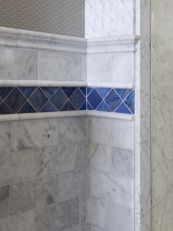 Design ideas for a large traditional master bathroom in Portland Maine with a drop-in sink, recessed-panel cabinets, white cabinets, marble benchtops, a drop-in tub, a double shower and marble floors.