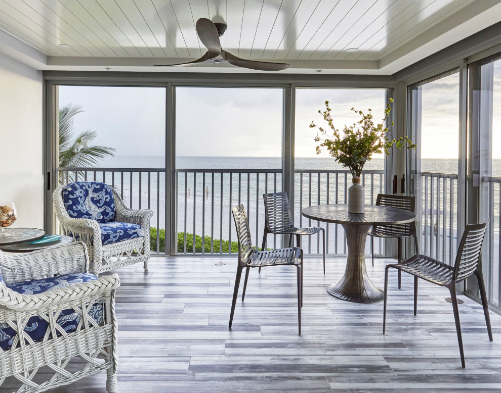 Inspiration for a mid-sized beach style sunroom with porcelain floors, a ribbon fireplace and grey floor.