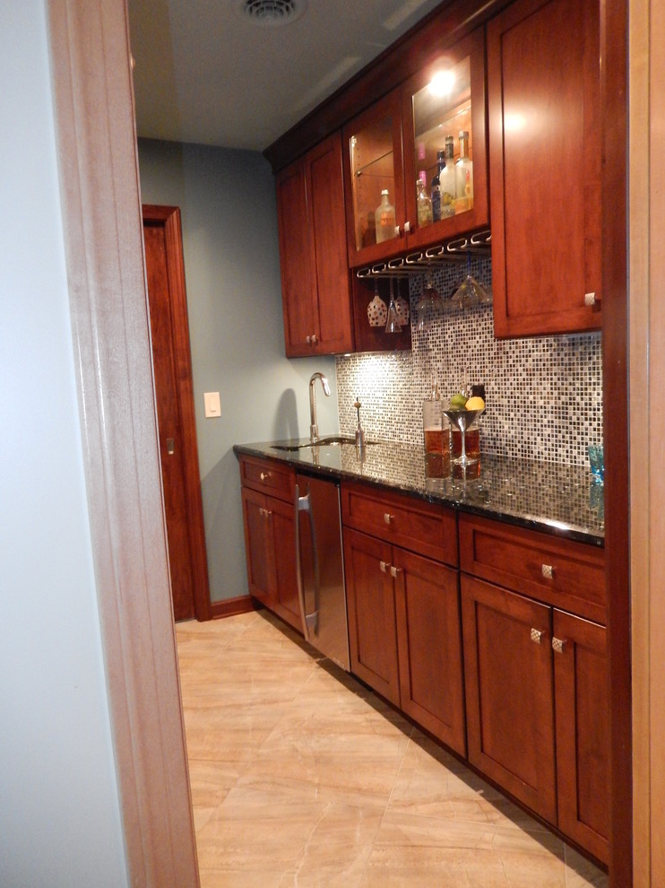 Photo of a mid-sized contemporary galley wet bar in Other with an undermount sink, shaker cabinets, medium wood cabinets, ceramic floors, mosaic tile splashback, quartz benchtops and grey floor.