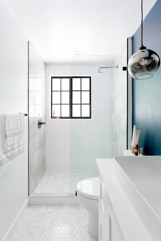 This is an example of a small transitional 3/4 bathroom in Orange County with shaker cabinets, white cabinets, an alcove shower, a one-piece toilet, gray tile, white tile, marble, blue walls, marble floors, a vessel sink, engineered quartz benchtops, grey floor, an open shower and white benchtops.