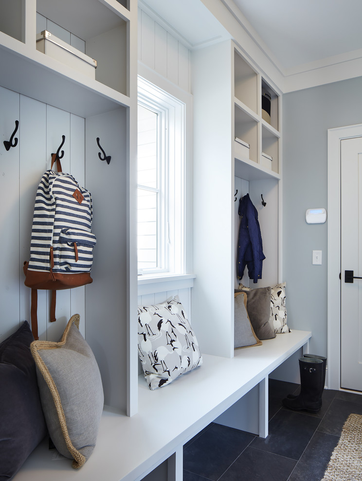 Mid-sized country mudroom in Minneapolis with blue walls, slate floors and grey floor.