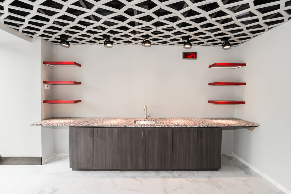 Example of a minimalist marble floor home design design in Baltimore with dark wood cabinets and recycled glass countertops