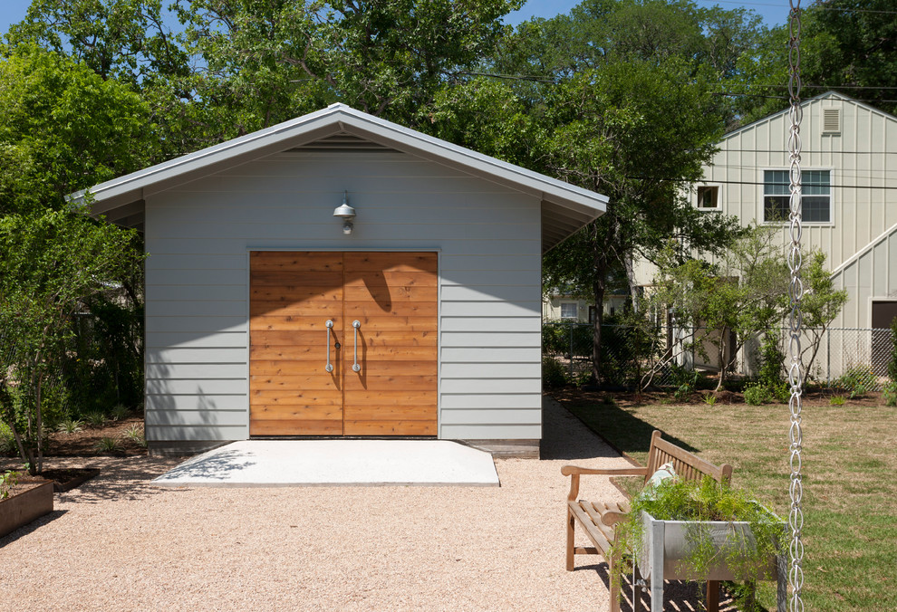 Photo of a contemporary one-car garage in Austin.