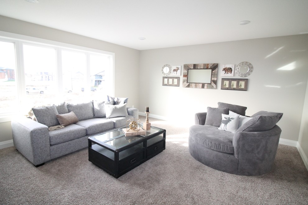 Inspiration for a large country open concept family room in Calgary with grey walls, carpet and a freestanding tv.