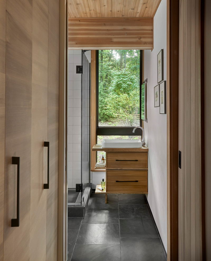 Lawless Retreat - As a retreat in an isolated setting both vanity and privacy were lesser priorities in this bath design where a view takes priority over a mirror.
