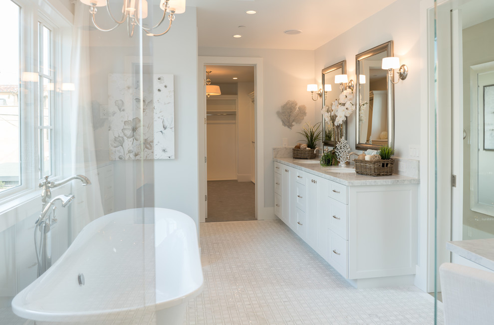 Design ideas for a beach style bathroom in Orange County with mosaic tile and marble floors.