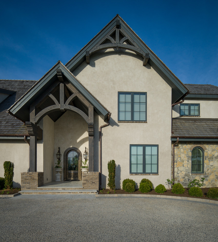 Photo of an expansive country front door in Charlotte with beige walls, slate floors, a single front door and a glass front door.