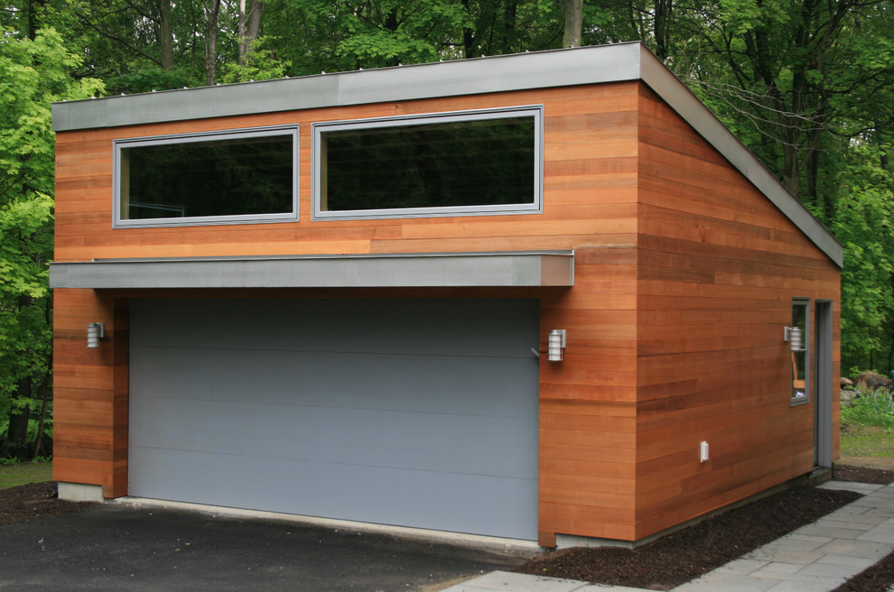 This is an example of a large contemporary detached two-car garage in Boston.