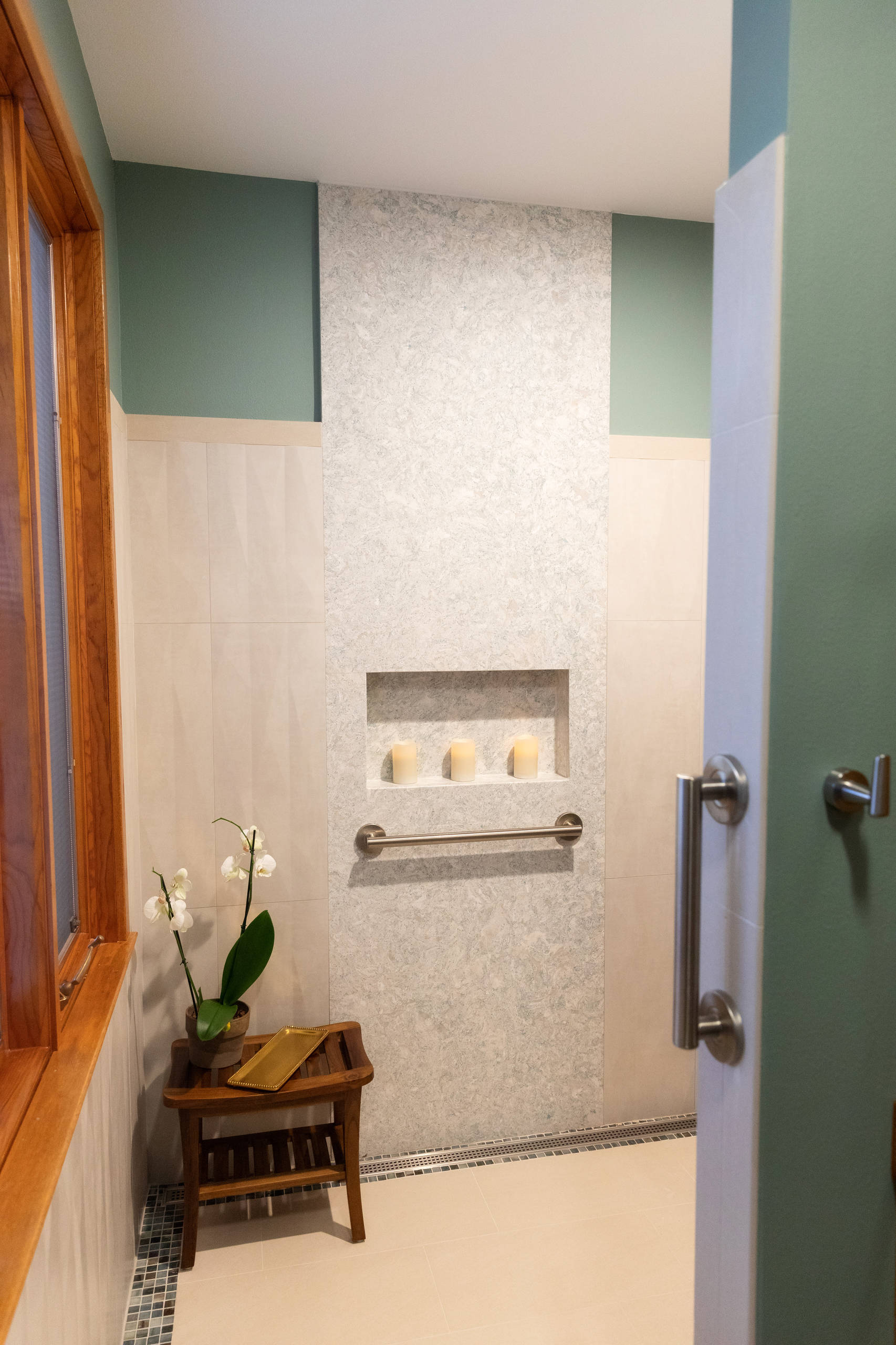 Bathroom - mid-sized contemporary master multicolored tile and mosaic tile vinyl floor and brown floor bathroom idea with flat-panel cabinets, light wood cabinets, green walls, an undermount sink, qua