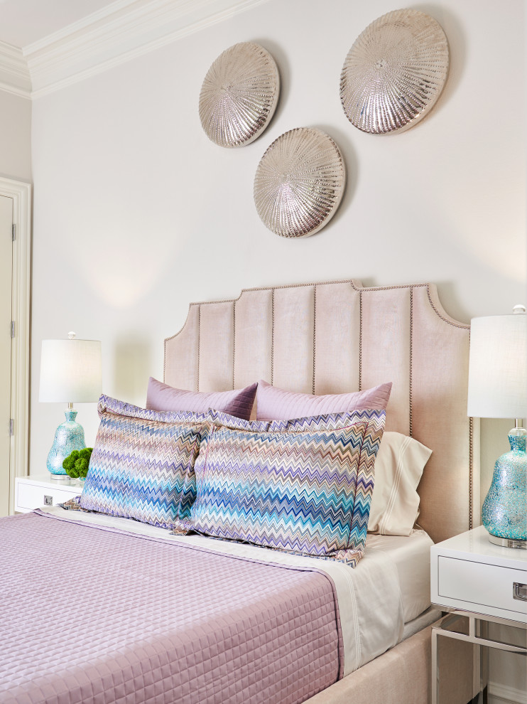 This is an example of a mid-sized beach style guest bedroom in Other with white walls, light hardwood floors and beige floor.