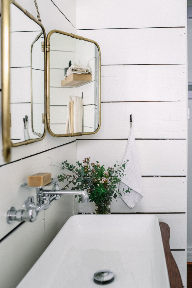 Design ideas for a small traditional bathroom in Dallas with dark wood cabinets, a claw-foot tub, a shower/bathtub combo, a one-piece toilet, white walls, limestone floors, a vessel sink, wood benchtops, grey floor, a shower curtain and brown benchtops.