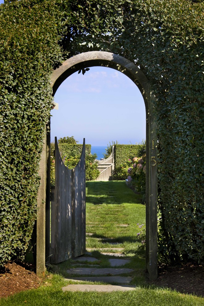 Inspiration for a coastal full sun backyard stone formal garden in Boston.