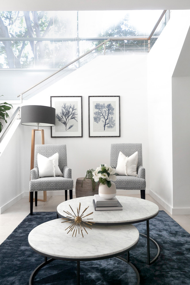Transitional living room in Sydney with white walls.