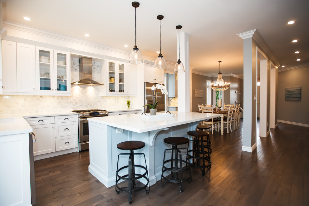 Mid-sized transitional galley dark wood floor eat-in kitchen photo in Toronto with an undermount sink, shaker cabinets, white cabinets, granite countertops, white backsplash, stone tile backsplash, stainless steel appliances and an island