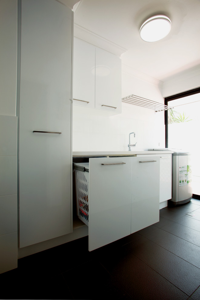 Photo of a transitional laundry room in Perth.