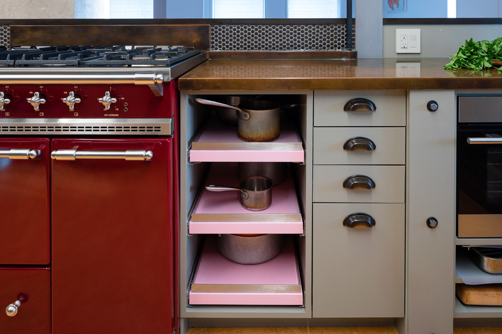 Inspiration for a large industrial galley separate kitchen in New York with an integrated sink, flat-panel cabinets, grey cabinets, copper benchtops, stainless steel appliances, cork floors, no island and brown floor.