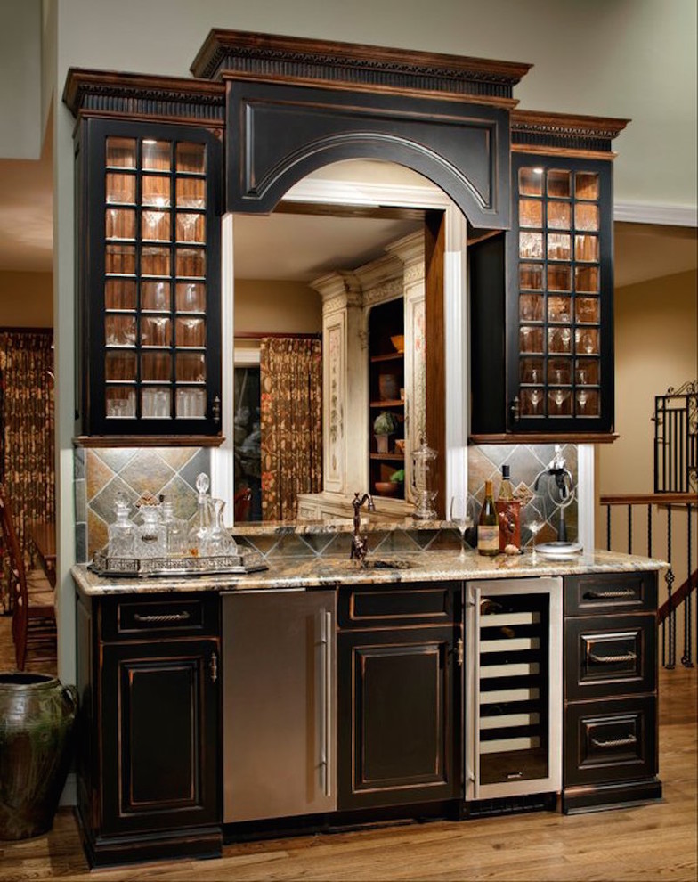 Design ideas for a small country single-wall wet bar in Other with an undermount sink, raised-panel cabinets, black cabinets, terrazzo benchtops, light hardwood floors, slate splashback and beige floor.