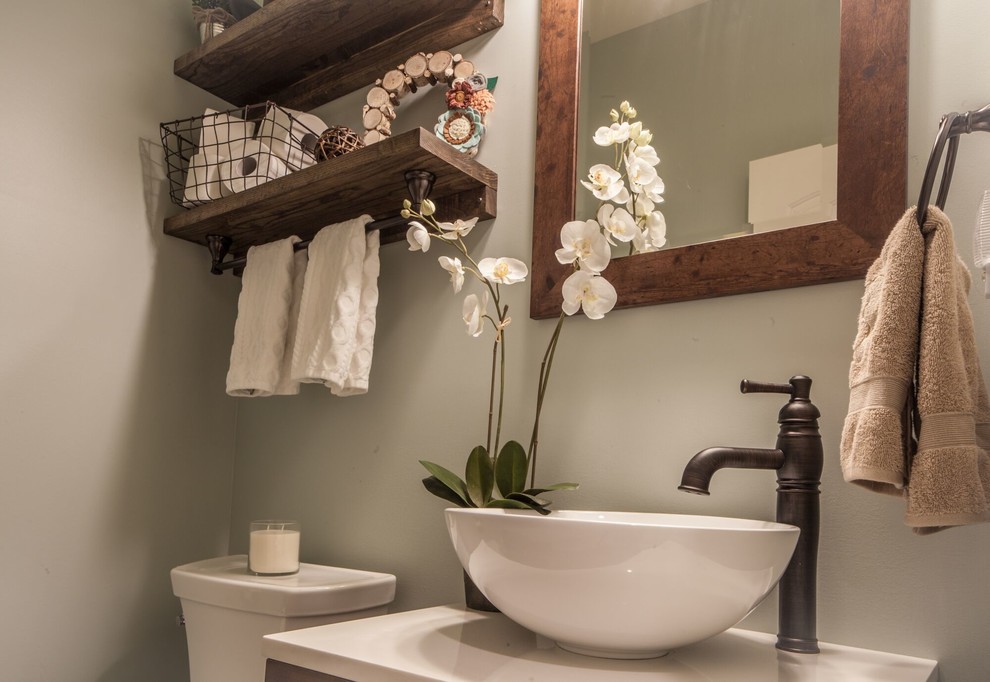 Freestanding bathtub - mid-sized transitional master beige tile and stone tile ceramic tile and beige floor freestanding bathtub idea with raised-panel cabinets, medium tone wood cabinets, beige walls, an undermount sink, granite countertops and a hinged shower door