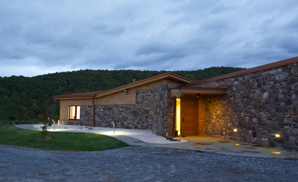 Photo of a contemporary one-storey exterior in Portland Maine with stone veneer.