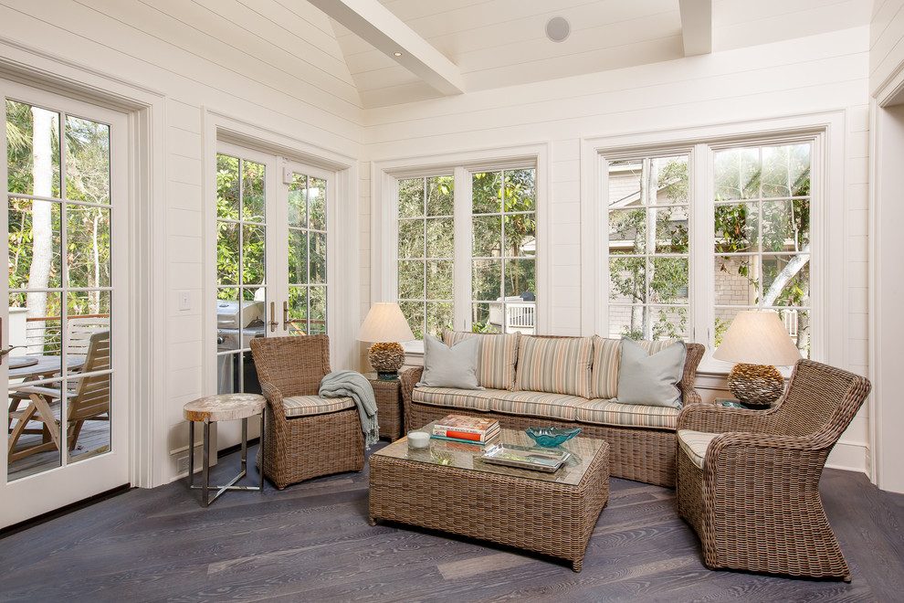 Beach style sunroom in Other with dark hardwood floors, no fireplace, a standard ceiling and brown floor.