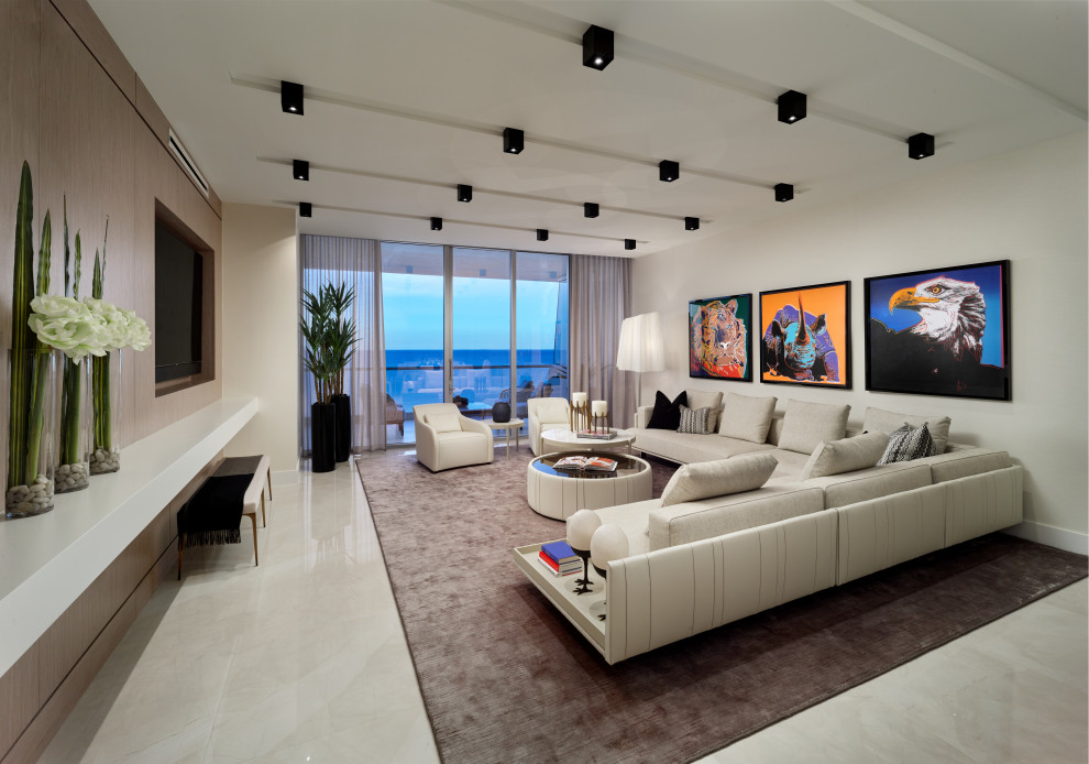 Esempio di un grande soggiorno contemporaneo aperto con pareti bianche, pavimento in gres porcellanato e pavimento beige