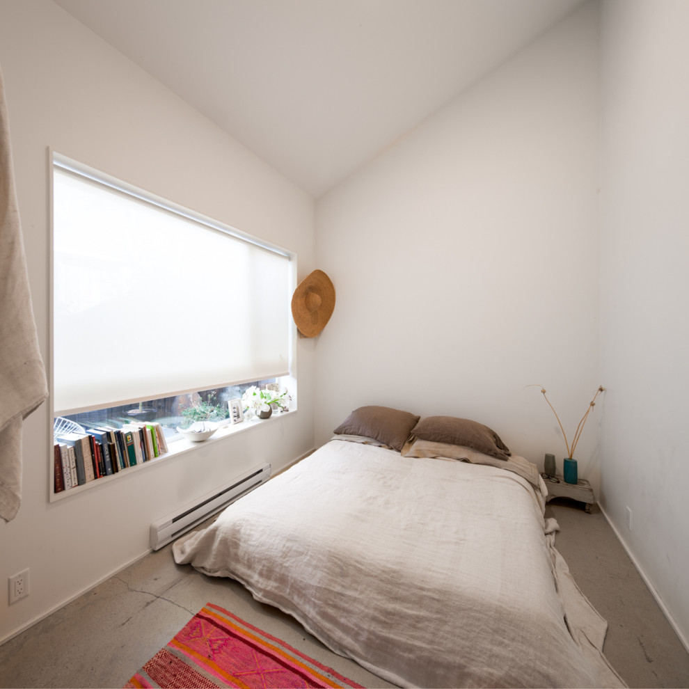 Пример оригинального дизайна: спальня в стиле модернизм с бетонным полом