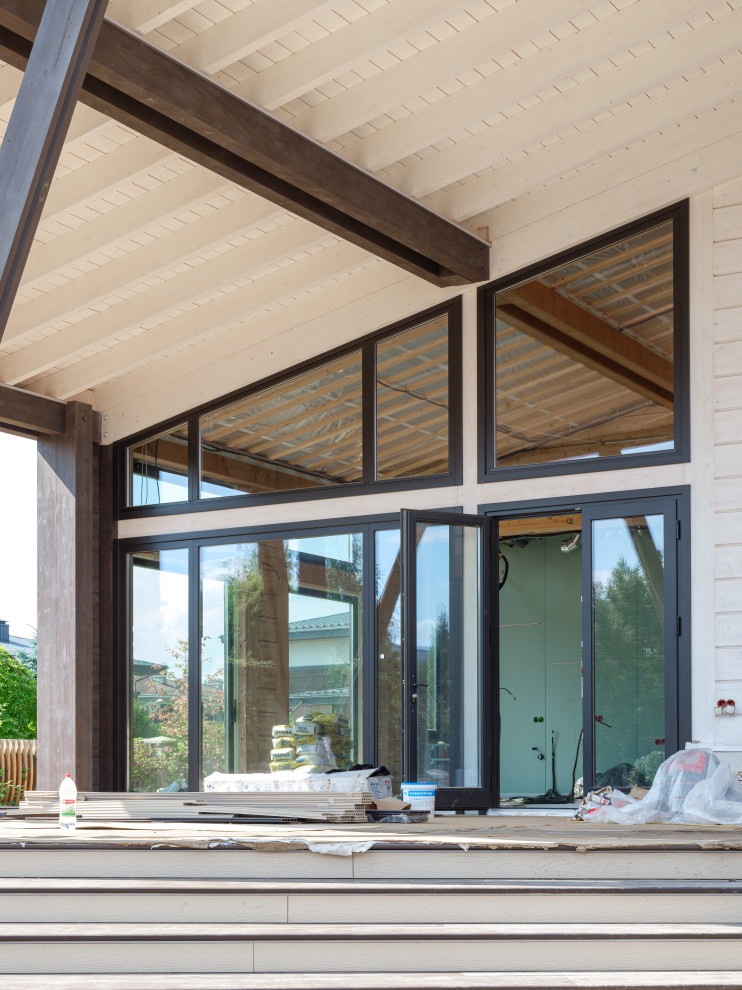 Трапецевидные окна, порталы и входные двери для современного дома