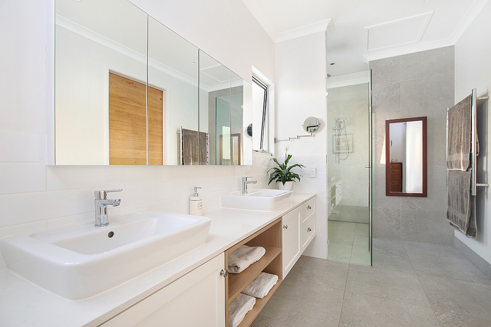 Design ideas for a large contemporary master bathroom in Sunshine Coast with shaker cabinets, white cabinets, a double shower, gray tile, porcelain tile, white walls, porcelain floors, a vessel sink and engineered quartz benchtops.