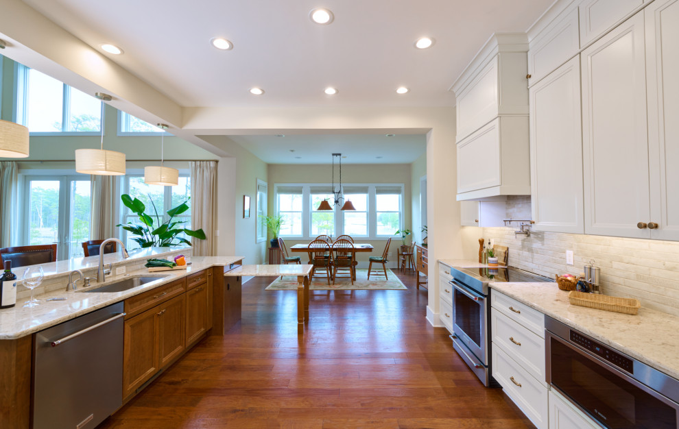 Inspiration for a huge transitional u-shaped open concept kitchen remodel in DC Metro with a drop-in sink, recessed-panel cabinets, quartz countertops, multicolored backsplash, stainless steel appliances and an island