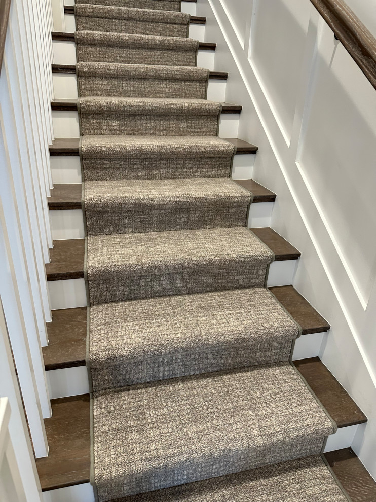 Mid-sized transitional wooden l-shaped wood railing and wall paneling staircase photo in Orange County with painted risers