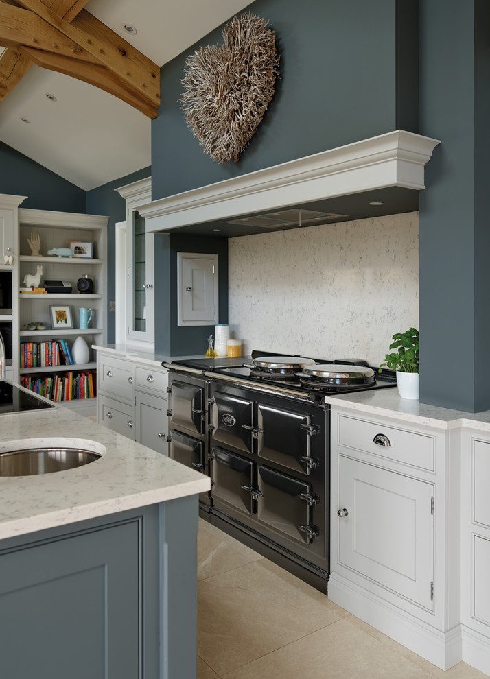 Design ideas for a large contemporary galley open plan kitchen in Manchester with a farmhouse sink, beaded inset cabinets, grey cabinets, solid surface benchtops, white splashback, stainless steel appliances, marble floors and with island.