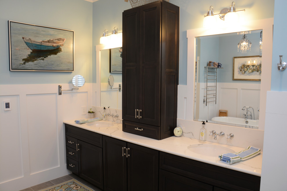 Large traditional master bathroom in Baltimore with recessed-panel cabinets, black cabinets, a claw-foot tub, a corner shower, blue walls, an undermount sink, engineered quartz benchtops, grey floor, a hinged shower door, white benchtops, a double vanity, a built-in vanity and panelled walls.
