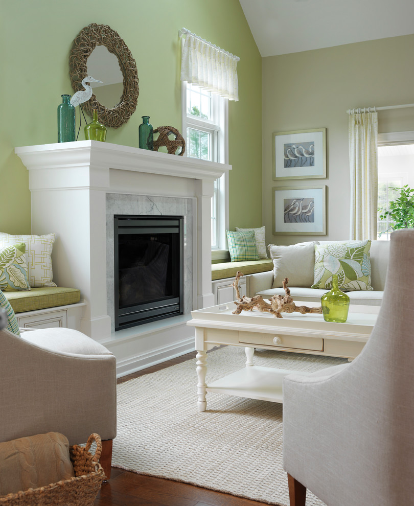 Inspiration for a mid-sized beach style formal enclosed living room in Boston with green walls, medium hardwood floors, a stone fireplace surround, a standard fireplace and no tv.