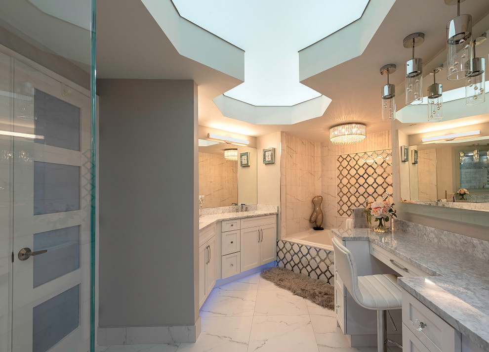 This is an example of a mid-sized modern master bathroom in Miami with white cabinets, a drop-in tub, white tile, granite benchtops, grey benchtops, a single vanity, a built-in vanity and wallpaper.