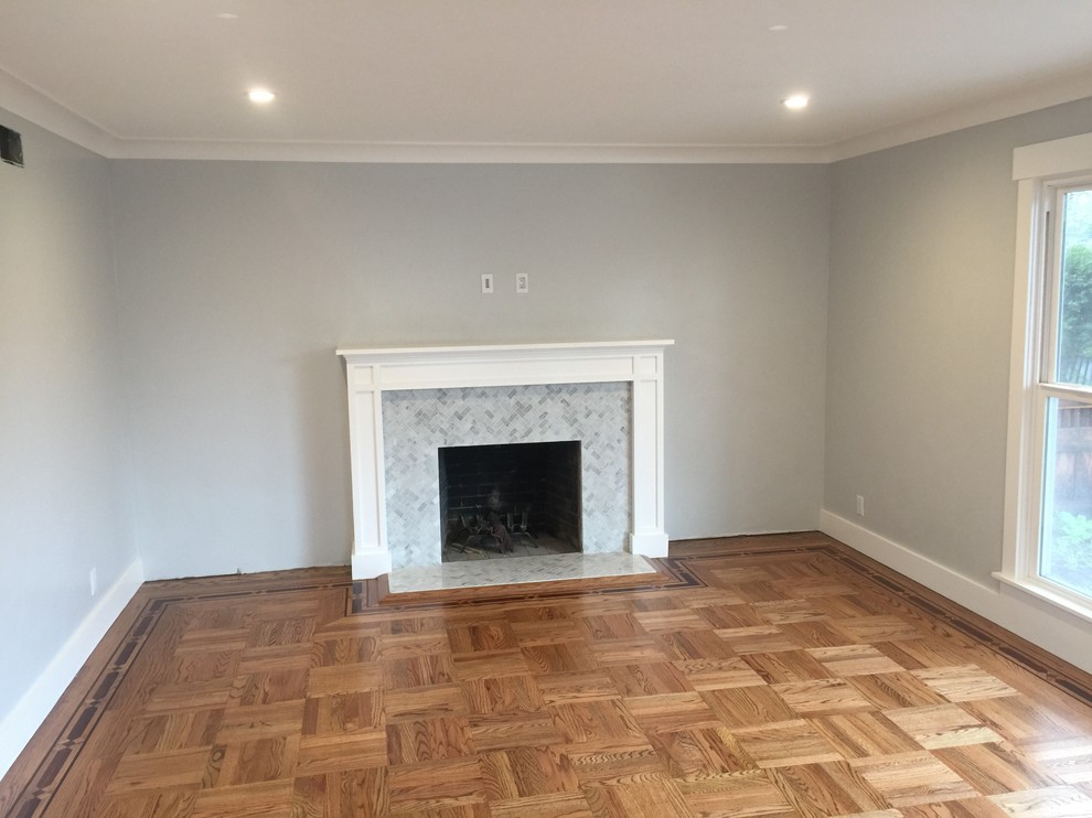 Design ideas for a large transitional formal enclosed living room in San Francisco with grey walls, light hardwood floors, a standard fireplace, a tile fireplace surround and no tv.