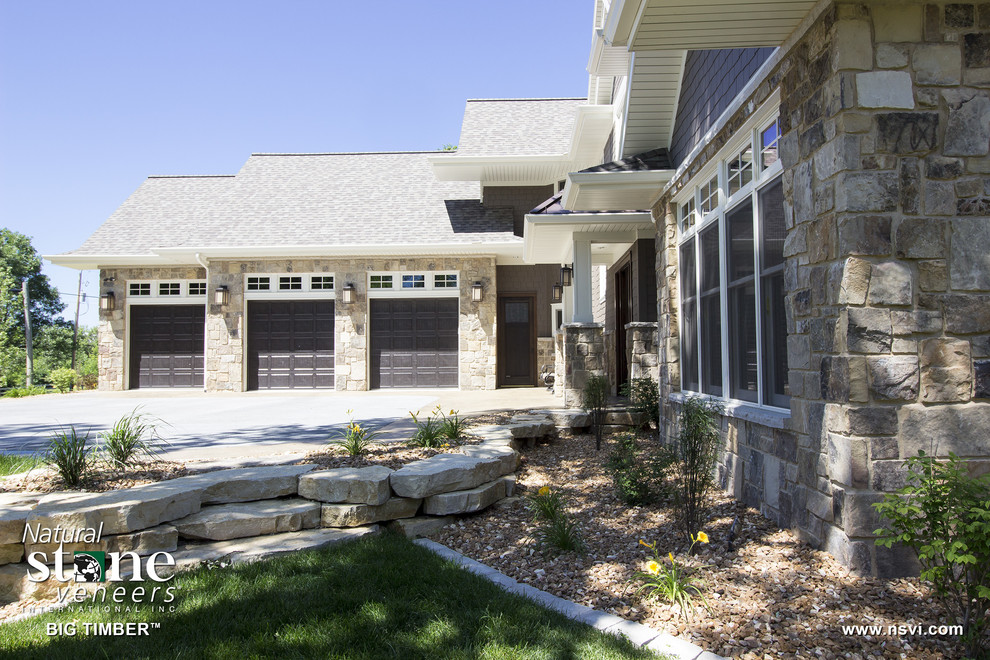Transitional two-storey brown exterior in Milwaukee with stone veneer.