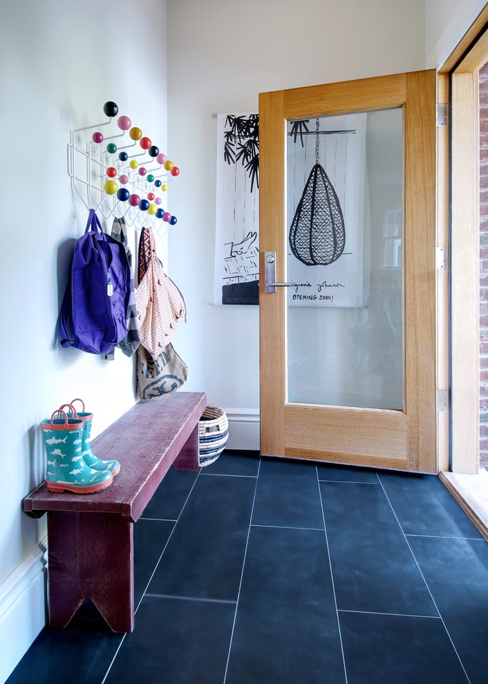 Mid-sized contemporary mudroom in Toronto with slate floors, black floor, white walls, a single front door and a medium wood front door.