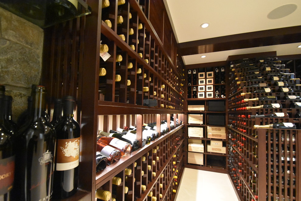Inspiration for a large contemporary wine cellar in Los Angeles with ceramic floors and display racks.